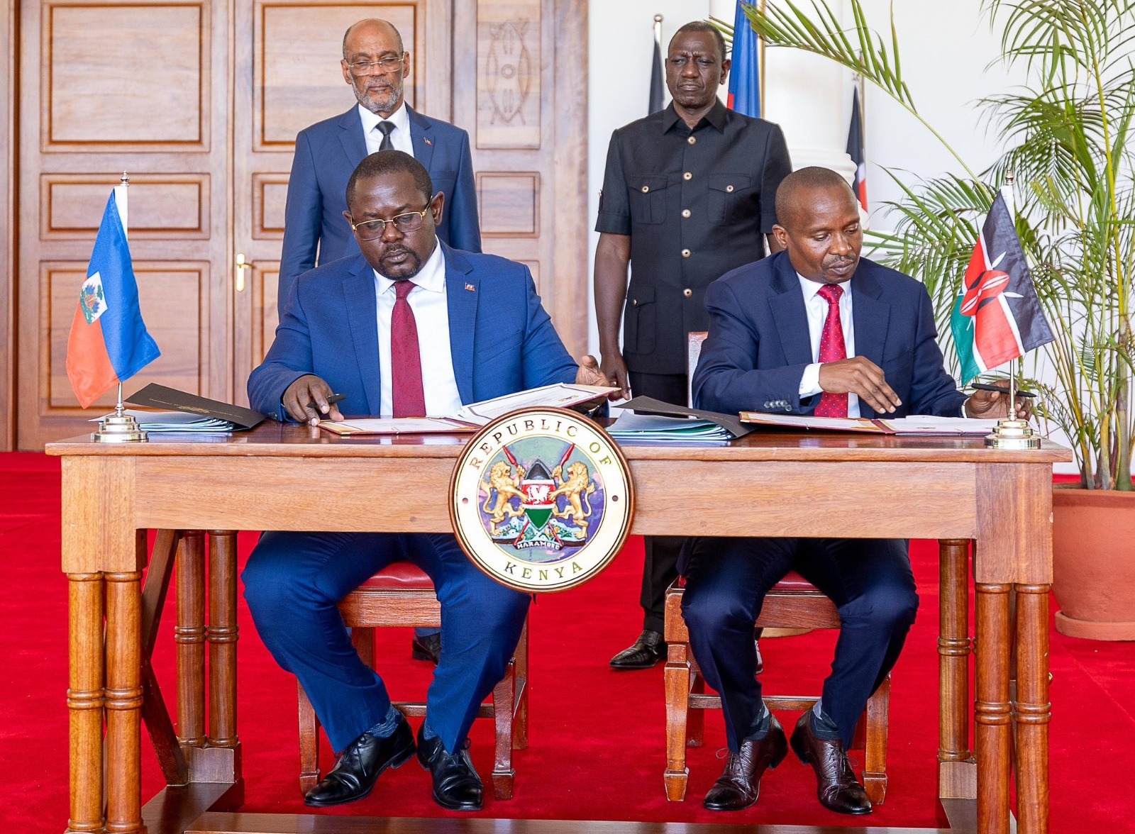 Interior CS Kithure Kindiki and his Haitian counterpart signing an agreement at State House.